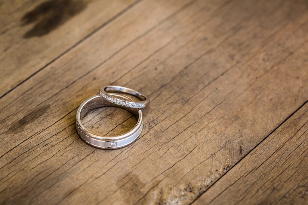 Wedding rings on timber.