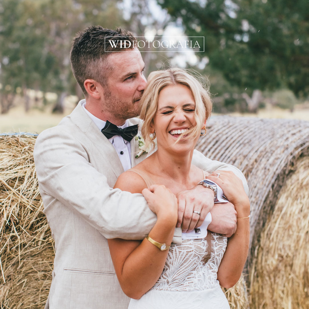 A wedding photo showing the happy moments of the bride and groom laughing and hugging each other. This photo is captured by WIDFOTOGRAFIA, Melbourne wedding photographer.