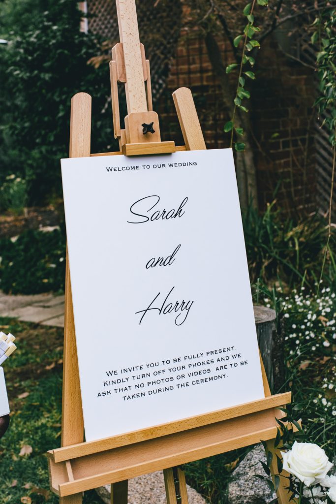 Wood wedding easel with bride and groom's name.