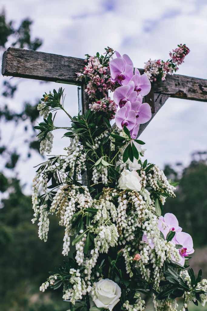 Beautiful flower decoration for wedding ceremony arch at Farm Vigano Wedding Melbourne.