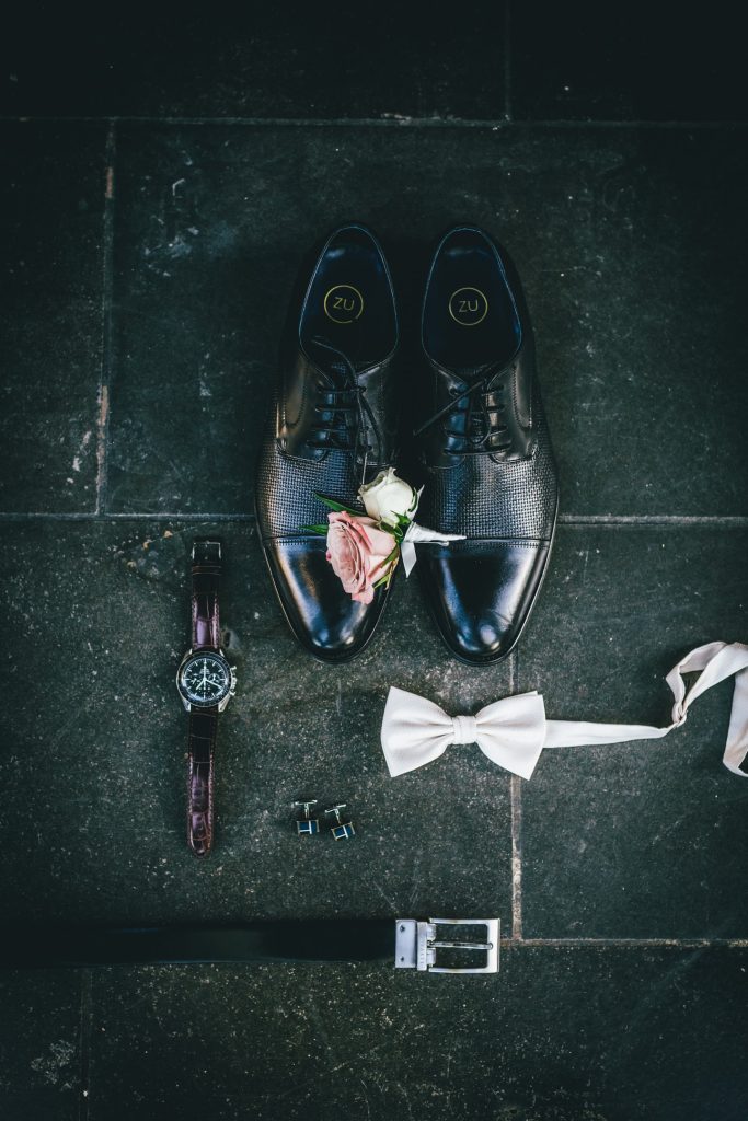 Groom's detailed wedding accessories for his wedding day.