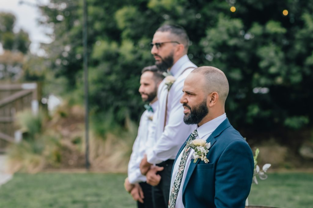 Groom and his groomsmen waiting for his bride to enter the wedding ceremony at Rocklea Farm Stonehaven.