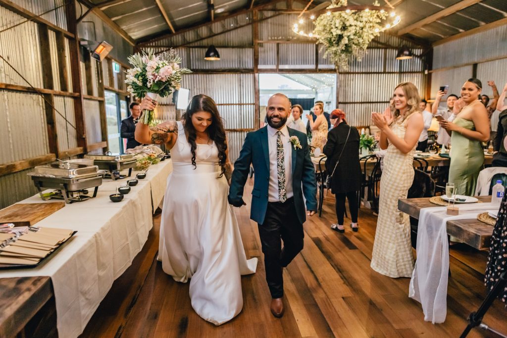 bride and groom making entrance at their reception at Rocklea Farm