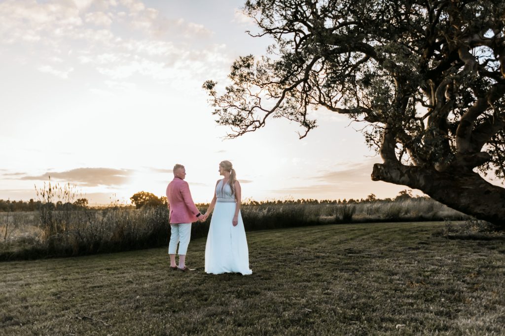 Beautiful sunset photo of bride and groom during wedding reception at Rocklea Farm wedding.