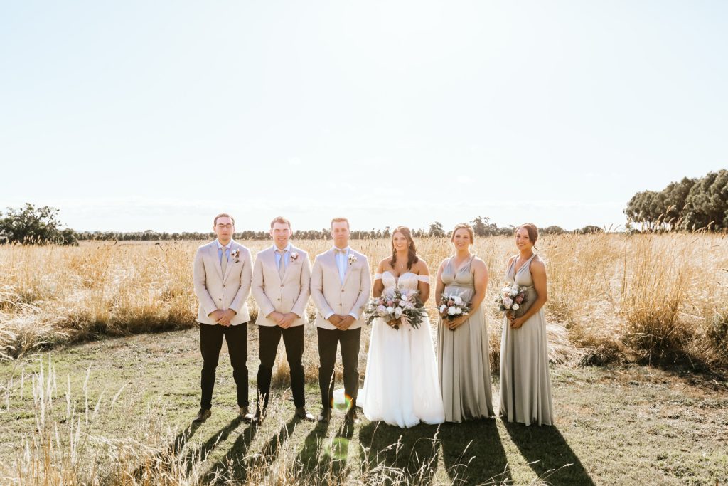 Wedding couple with their bridal party at Rocklea Farm Stonehaven wedding.